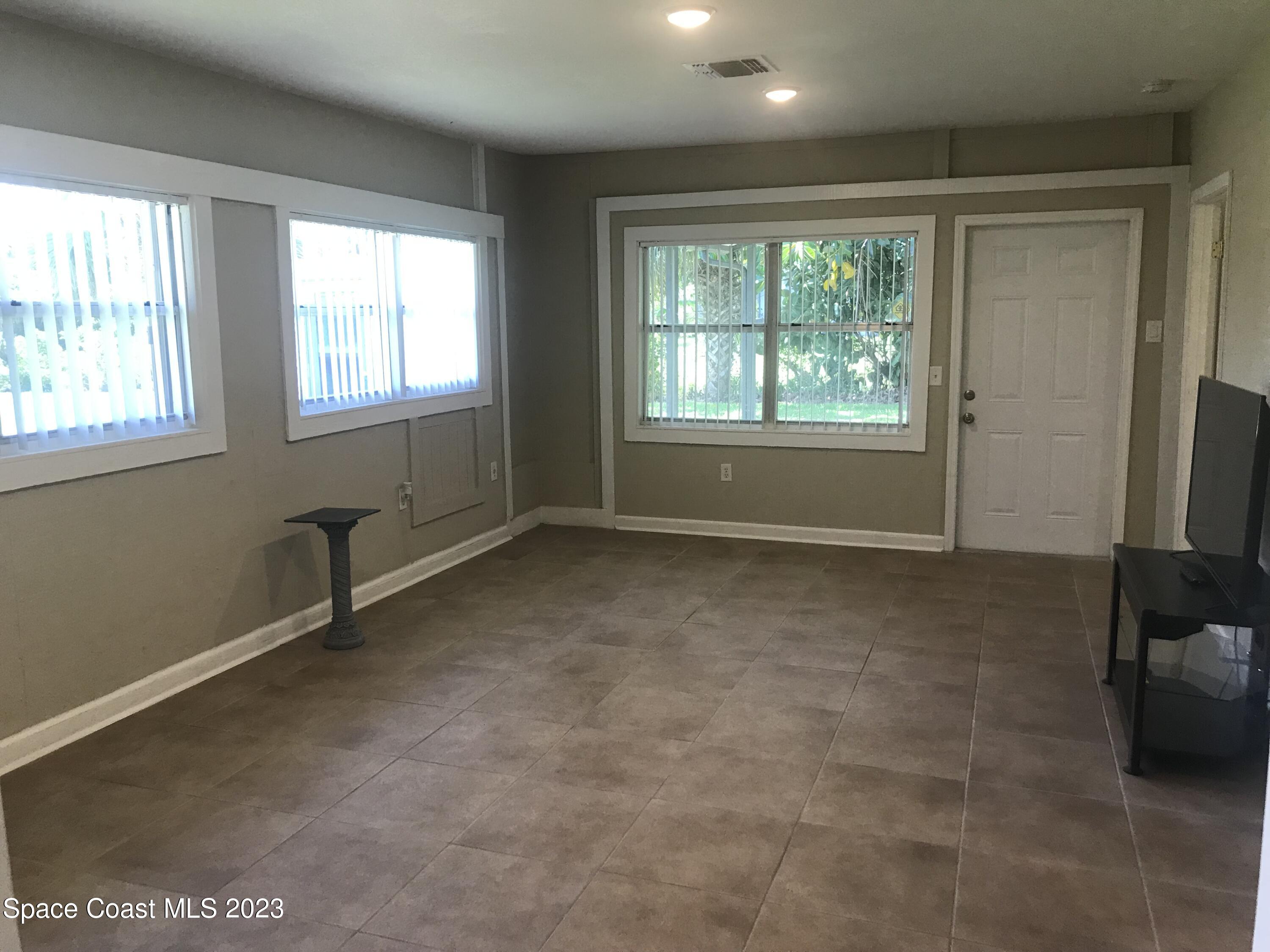 2525 Malabar Road Malabar, FL 32950 - Photo 3 of 30 an empty room with windows