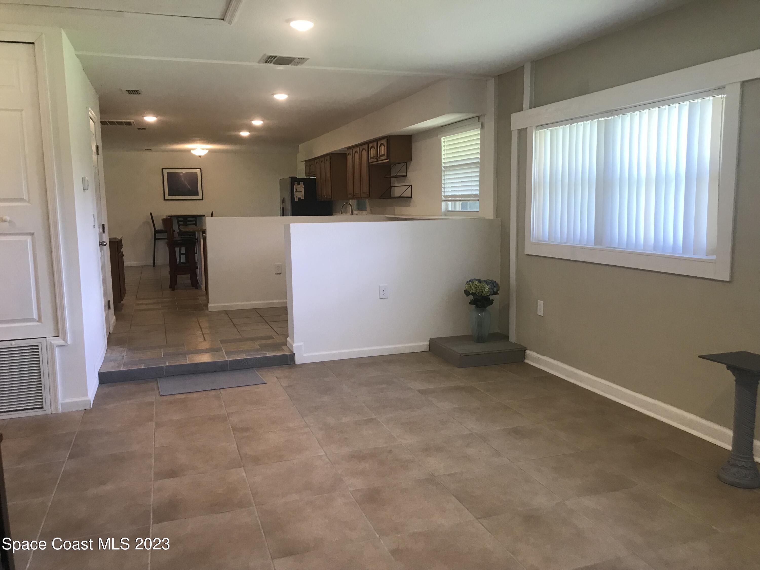 2525 Malabar Road Malabar, FL 32950 - Photo 5 of 30 a view of a livingroom with furniture and windows
