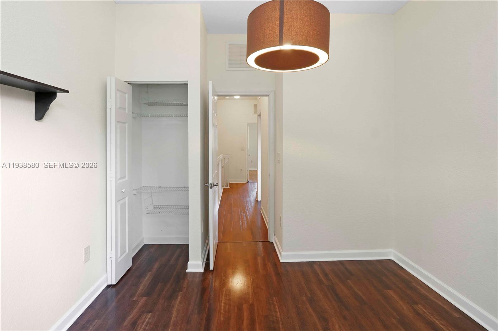9219 Southwest 227th Street, Unit 9 Cutler Bay, FL 33190 - Photo 31 of 42 a view of hallway with wooden floor