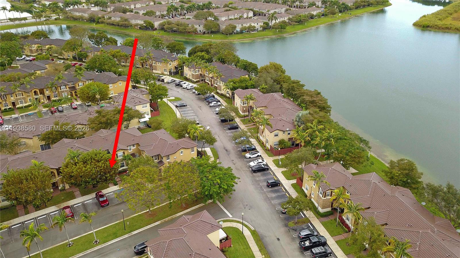 9219 Southwest 227th Street, Unit 9 Cutler Bay, FL 33190 - Photo 37 of 42 an aerial view of a house with a lake view