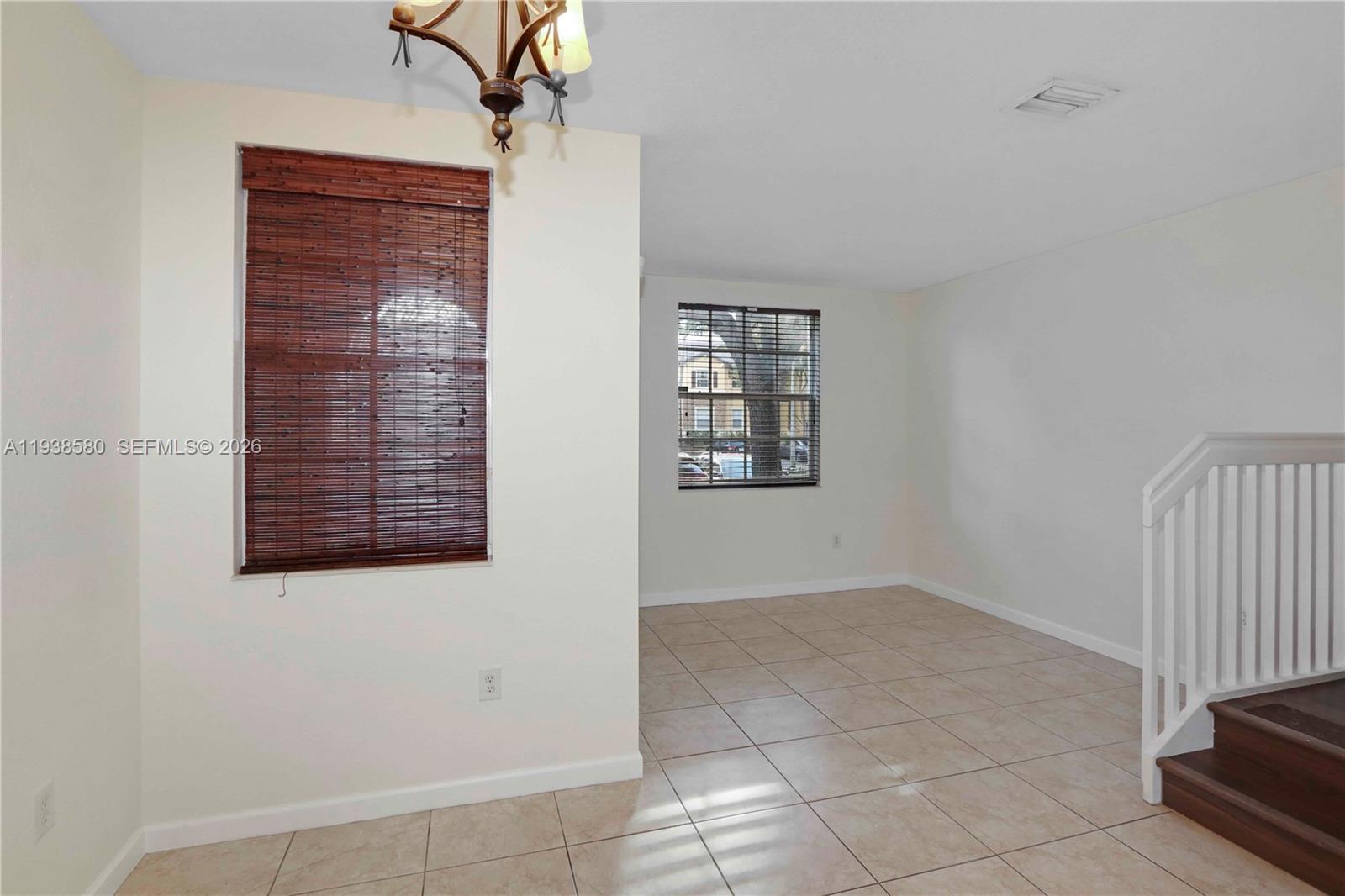 9219 Southwest 227th Street, Unit 9 Cutler Bay, FL 33190 - Photo 6 of 36 a view of an empty room with a window