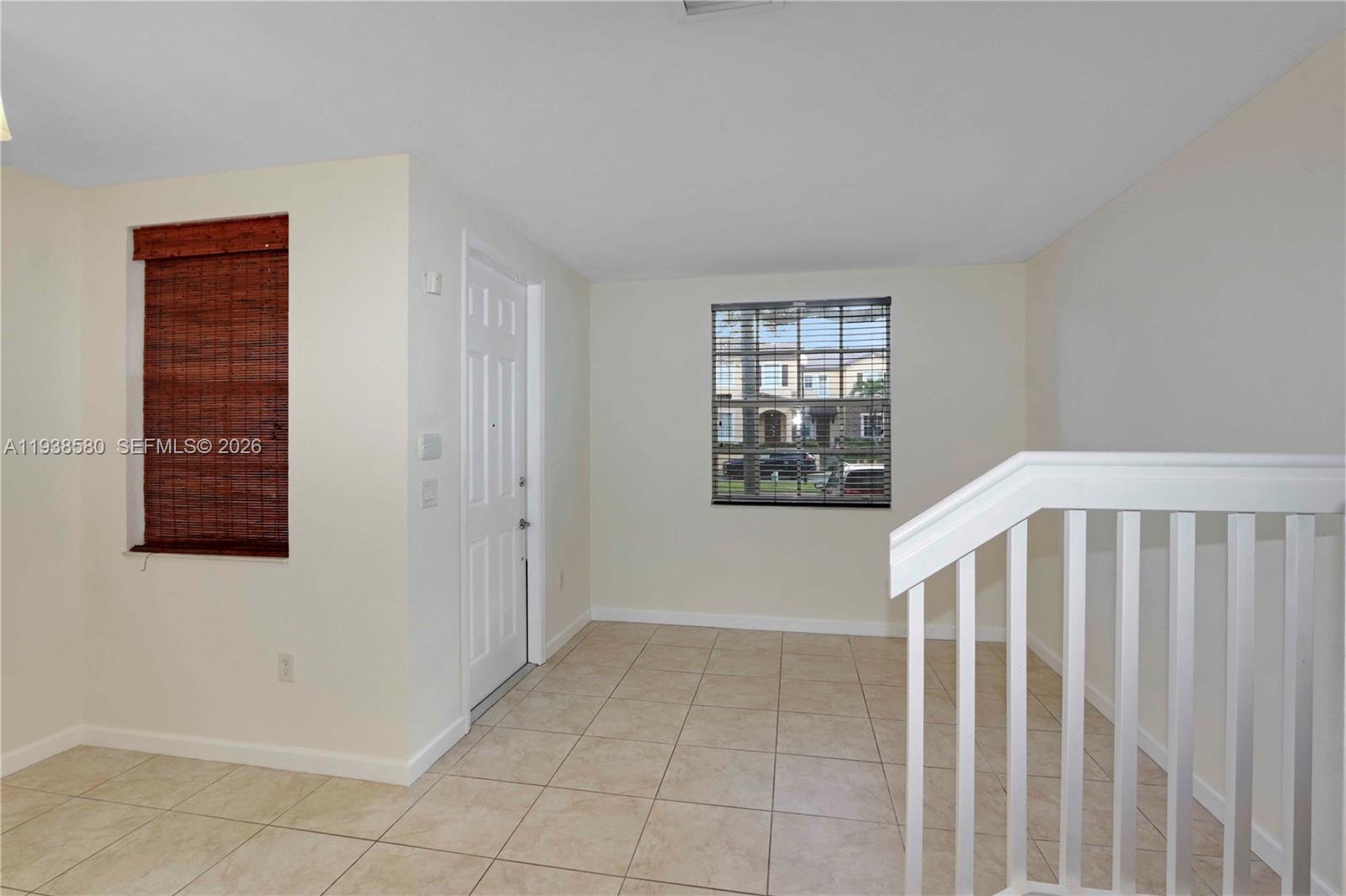 9219 Southwest 227th Street, Unit 9 Cutler Bay, FL 33190 - Photo 8 of 42 a view of an empty room with a window