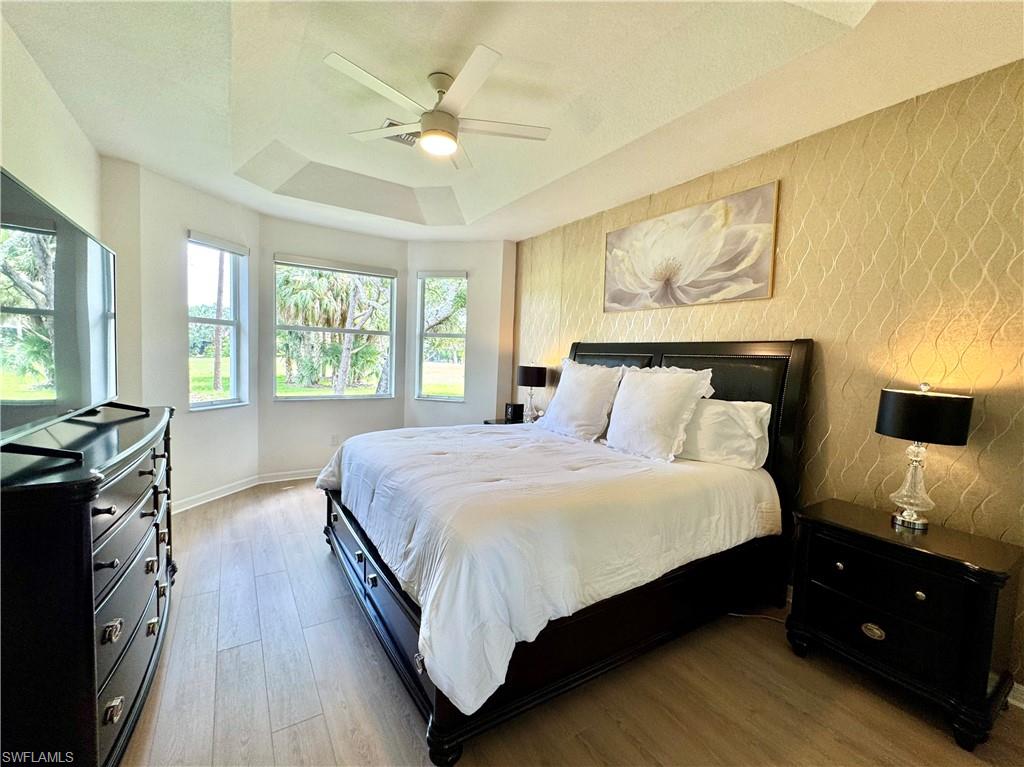 1905 Par Drive Naples, FL 34120 - Photo 11 of 30 a bedroom with a bed and wooden floor