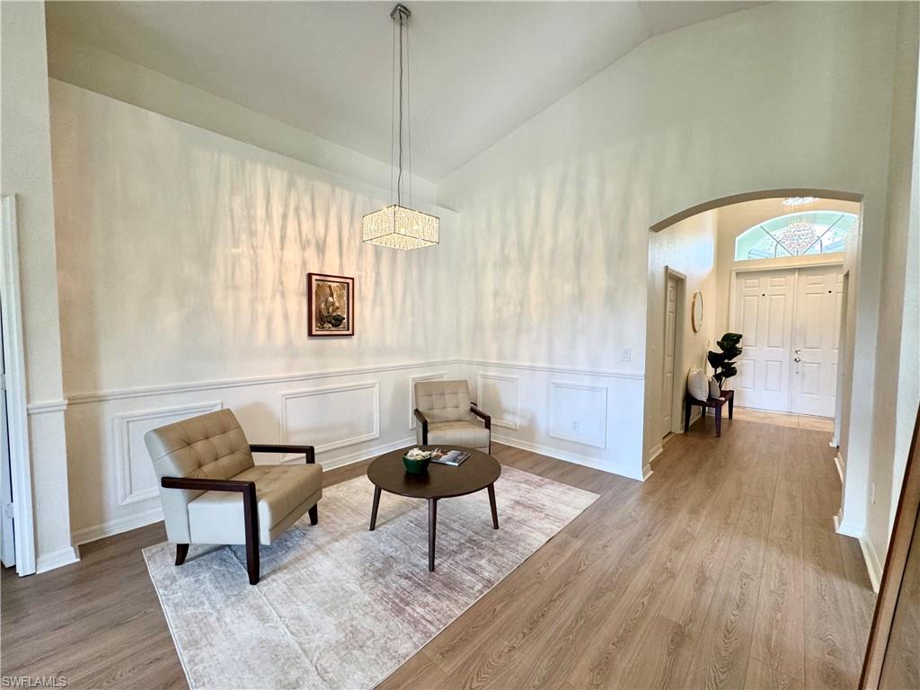1905 Par Drive Naples, FL 34120 - Photo 2 of 30 a living room with furniture and a wooden floor