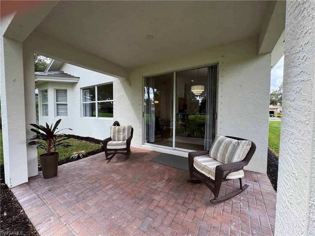 1905 Par Drive Naples, FL 34120 - Photo 21 of 30 a living room with furniture and a potted plant
