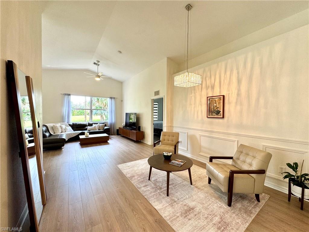 1905 Par Drive Naples, FL 34120 - Photo 3 of 30 a living room with furniture and a wooden floor