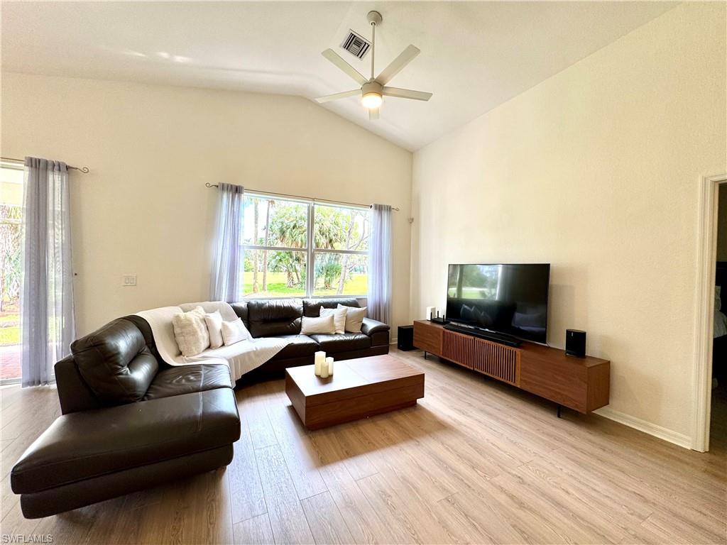 1905 Par Drive Naples, FL 34120 - Photo 5 of 30 a living room with furniture and a flat screen tv