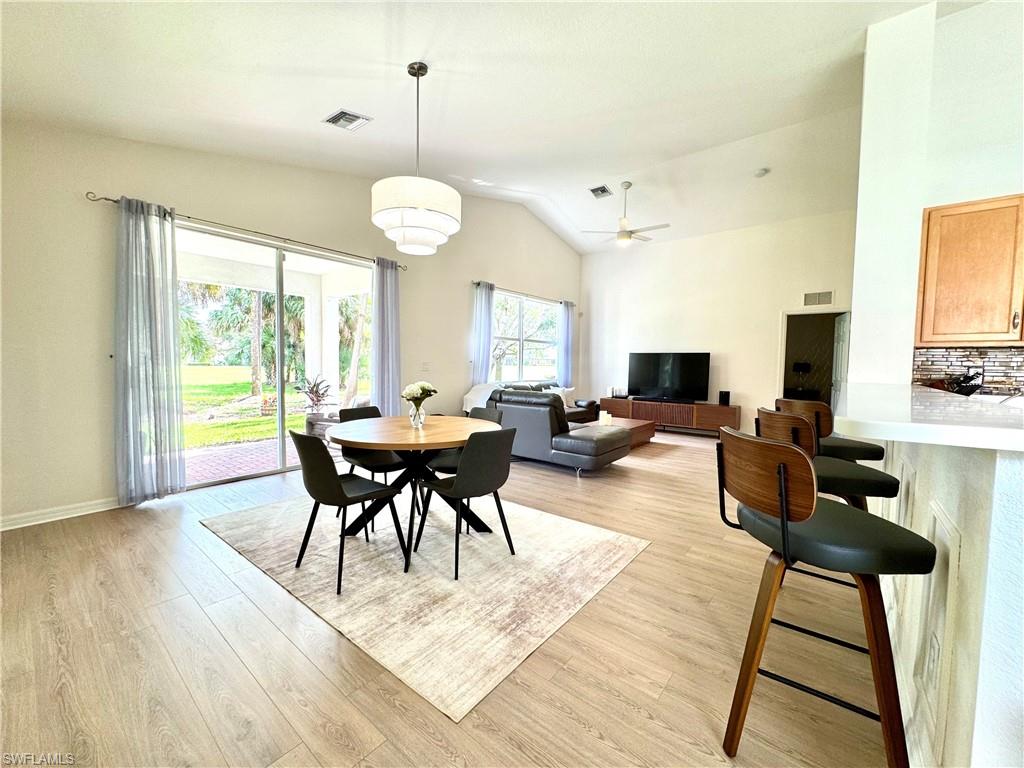 1905 Par Drive Naples, FL 34120 - Photo 6 of 30 a view of a dining room with furniture window and wooden floor