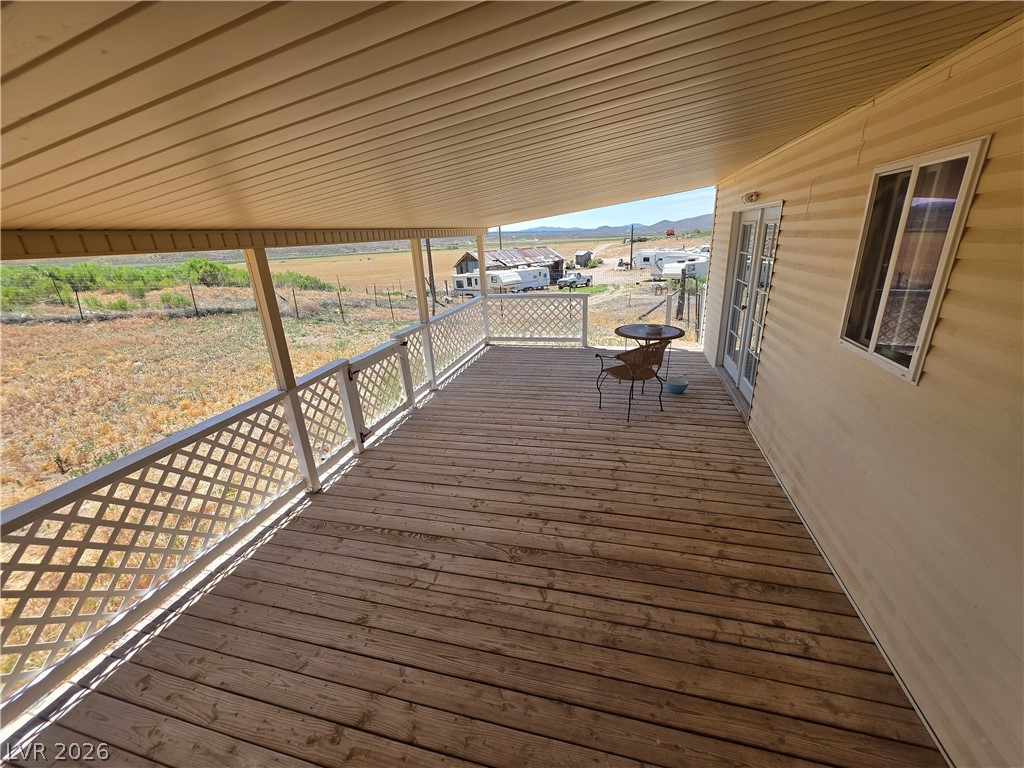 2930 Frehner Ranch Road Pioche, NV 89043 - Photo 23 of 39 Unwind on the ample covered deck, offering sweeping views of the surrounding natural landscape.