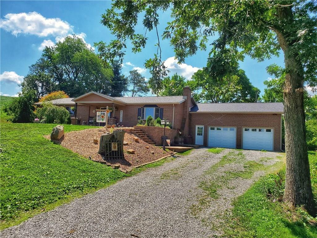 Front of house with oversized 2 car attached garage.