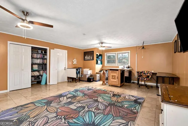 a view of a porch with a table and chairs