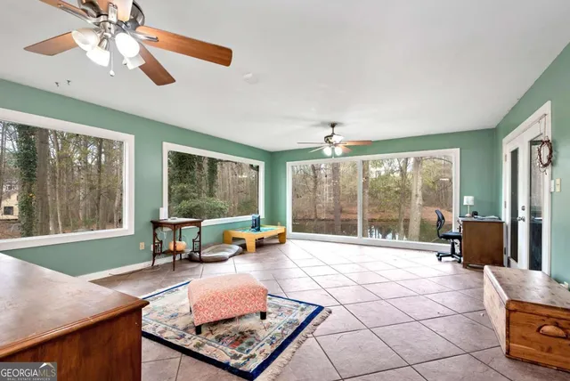 a view of a dining room with furniture wooden floor and a clock