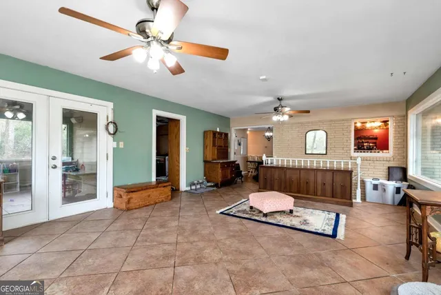 a bathroom with a toilet a sink a mirror a bathtub and shower