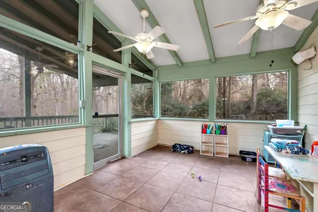 a living room with furniture rug and window