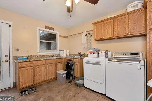 a bathroom with a sink mirror and toilet