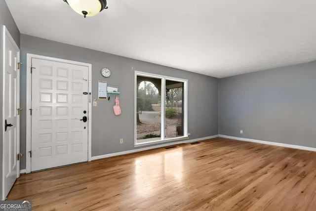 a view of room with wooden floor