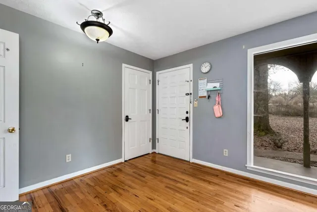 a view of a dining room with furniture wooden floor and a chandelier