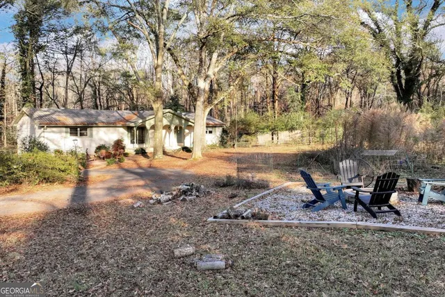 a view of a tree in front of a house