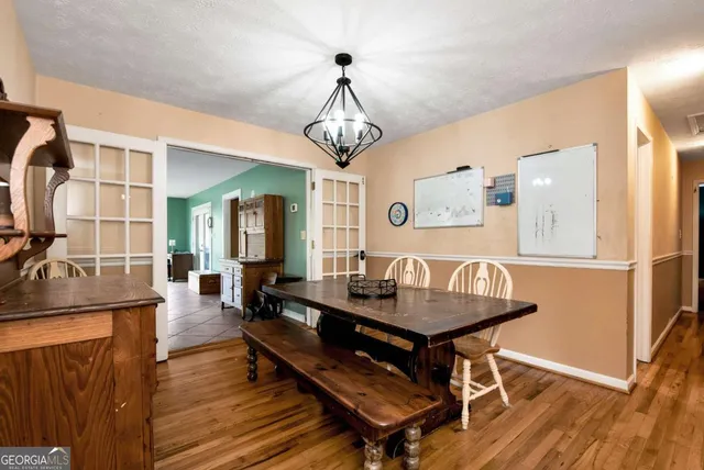 a kitchen with granite countertop a sink stainless steel appliances and cabinets
