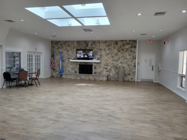 a room with gym equipment and a large window