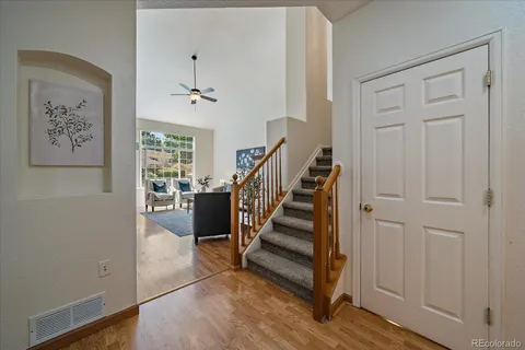 a view of entryway and hall with wooden floor