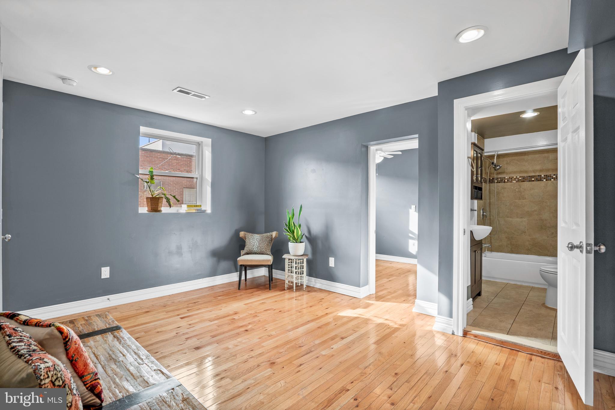 2024 South 12th Street, Unit 2 Philadelphia, PA 19148 - Photo 12 of 21 a bedroom with a bed and a table