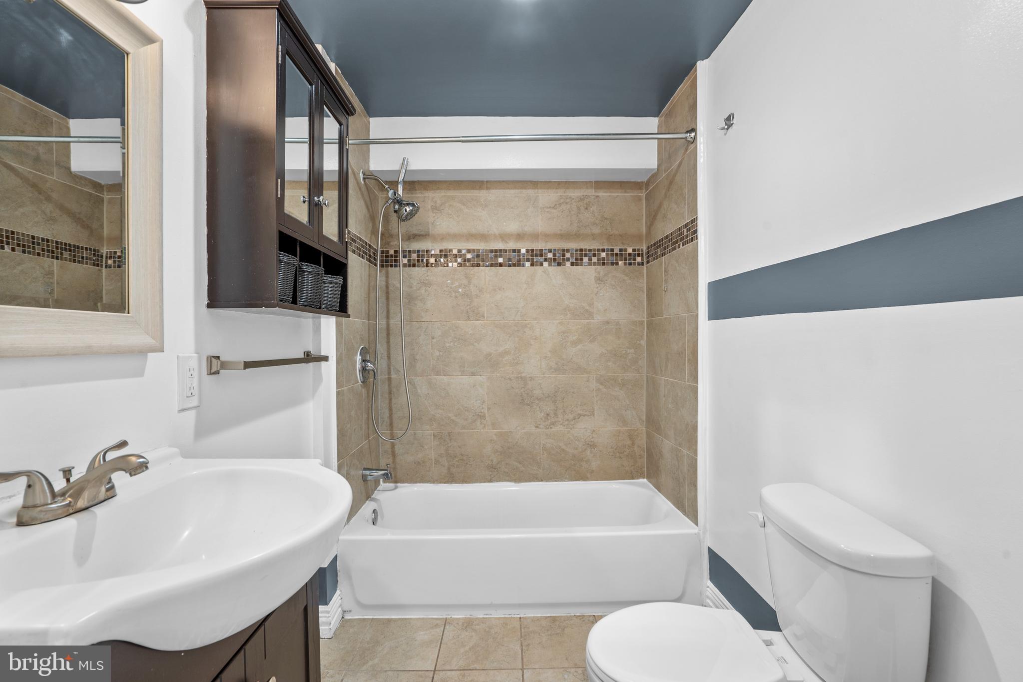 2024 South 12th Street, Unit 2 Philadelphia, PA 19148 - Photo 15 of 21 a bathroom with a sink toilet and bathtub