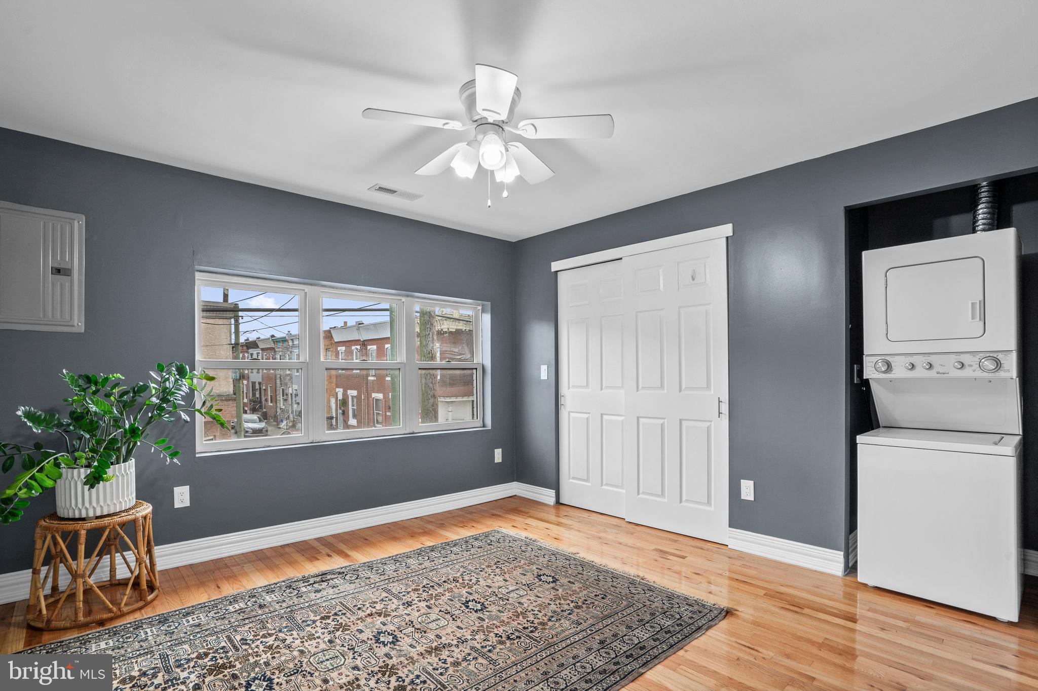 2024 South 12th Street, Unit 2 Philadelphia, PA 19148 - Photo 5 of 21 a view of an empty room with a window and wooden floor