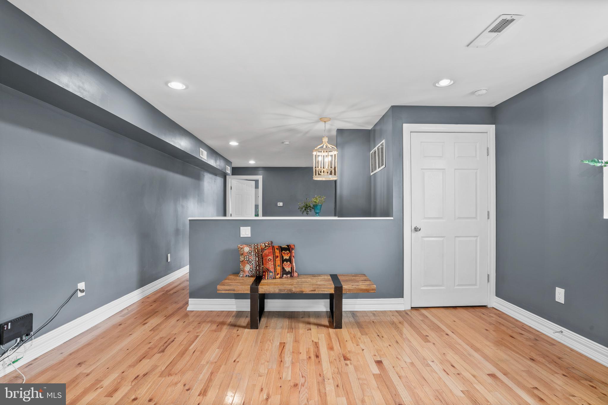 2024 South 12th Street, Unit 2 Philadelphia, PA 19148 - Photo 10 of 21 a view of room with wooden floor and lounge chair