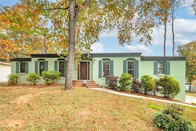 front view of a house with a yard