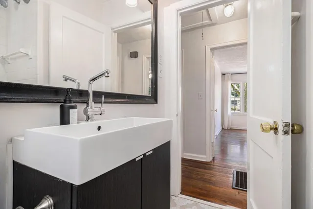 a bathroom with a sink and a mirror