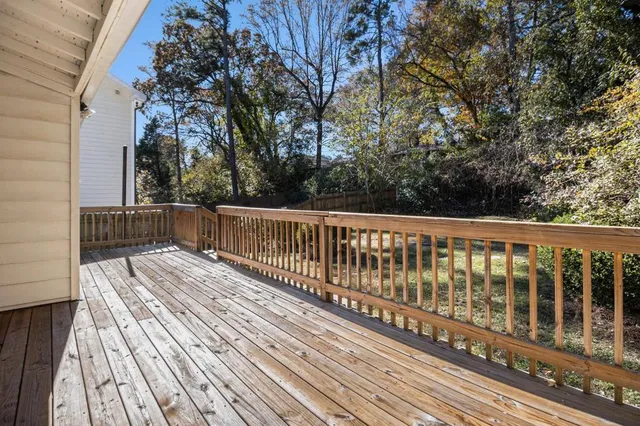a view of balcony with wooden floor