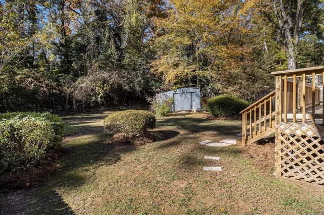 a house view with a backyard space