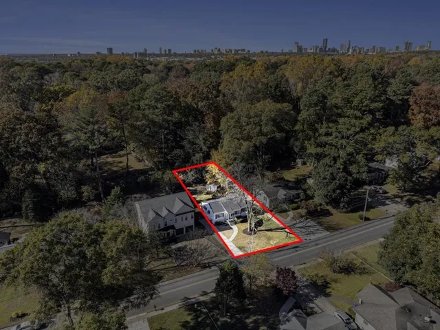 a view of a backyard with a table and chairs