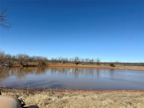 a view of a lake with outside of house
