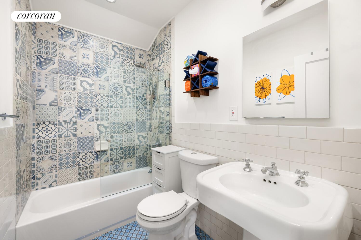 320 Macon Street, Unit 3 Brooklyn, NY 11216 - Photo 10 of 11 a white toilet sitting next to a bathroom sink