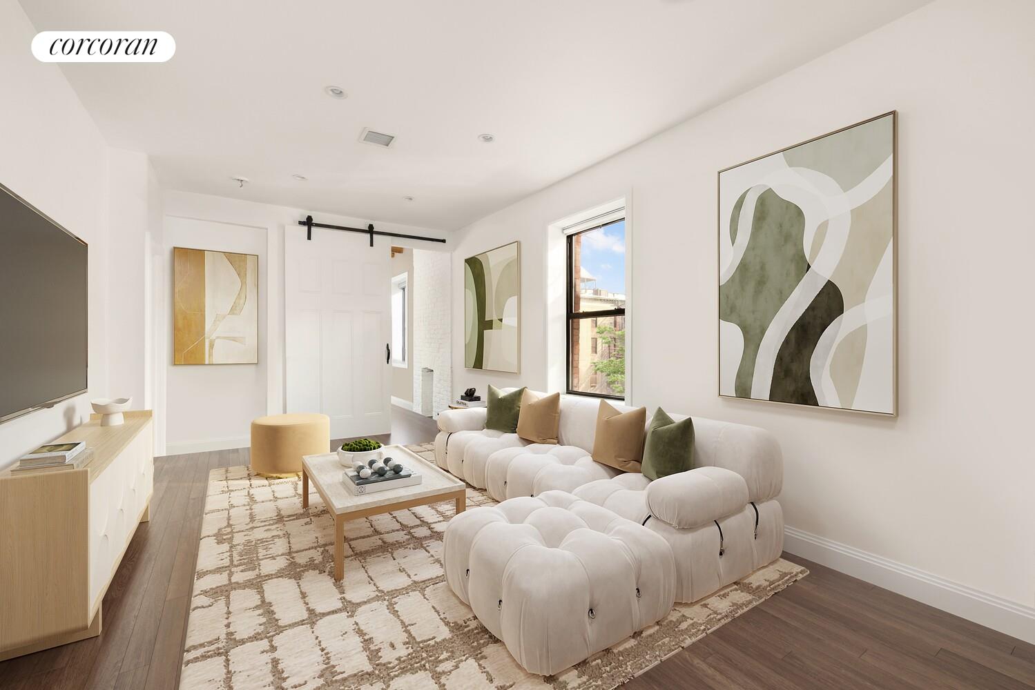320 Macon Street, Unit 3 Brooklyn, NY 11216 - Photo 2 of 11 a living room with furniture and a flat screen tv