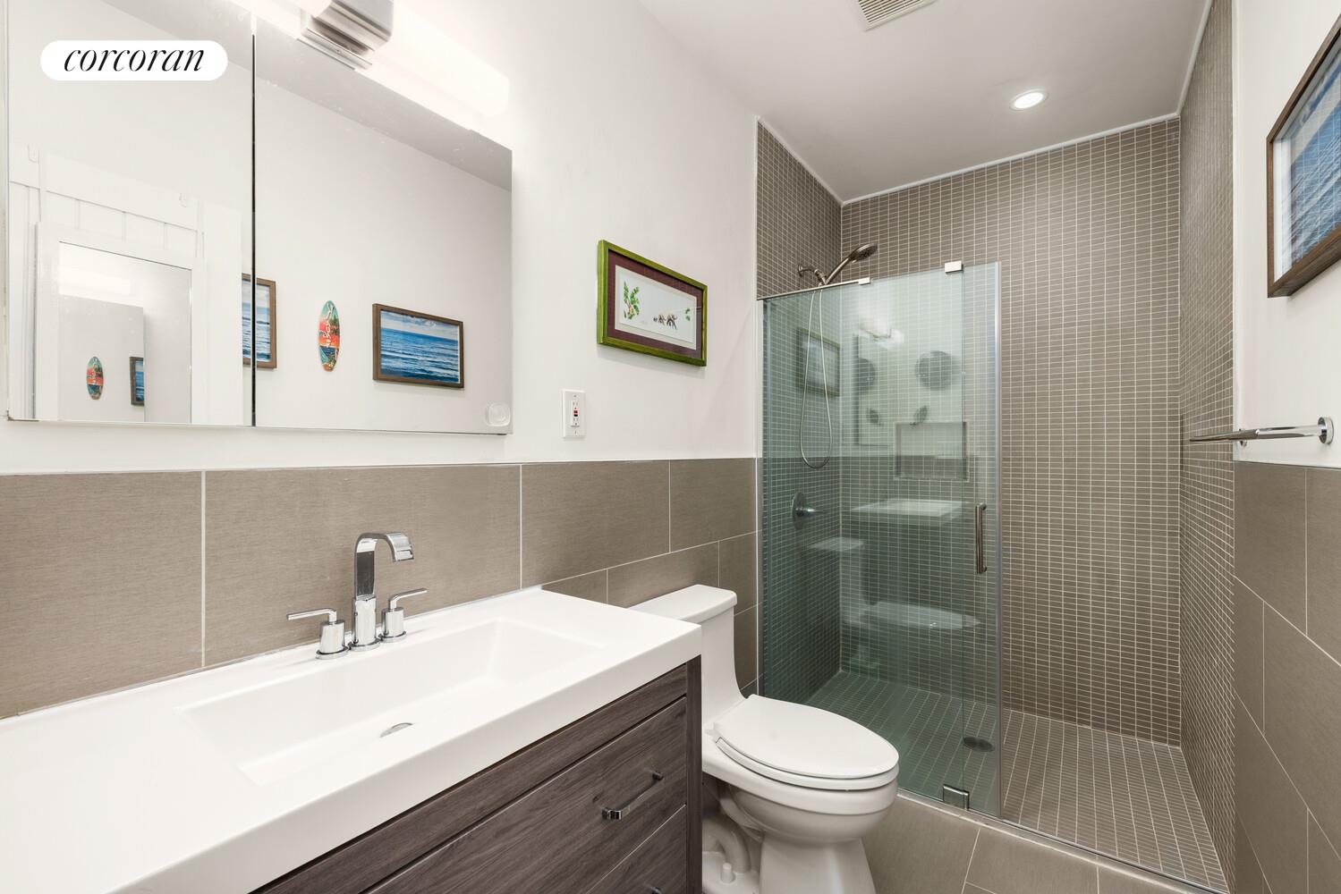 320 Macon Street, Unit 3 Brooklyn, NY 11216 - Photo 9 of 11 a bathroom with a sink a toilet and shower