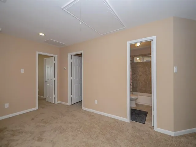 an empty room with closet area