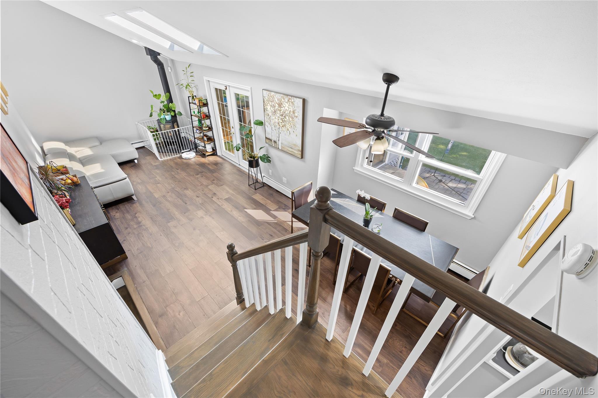 38 Oxford Road Old Bethpage, NY 11804 - Photo 9 of 23 a view of a livingroom with furniture hardwood floor and fireplace