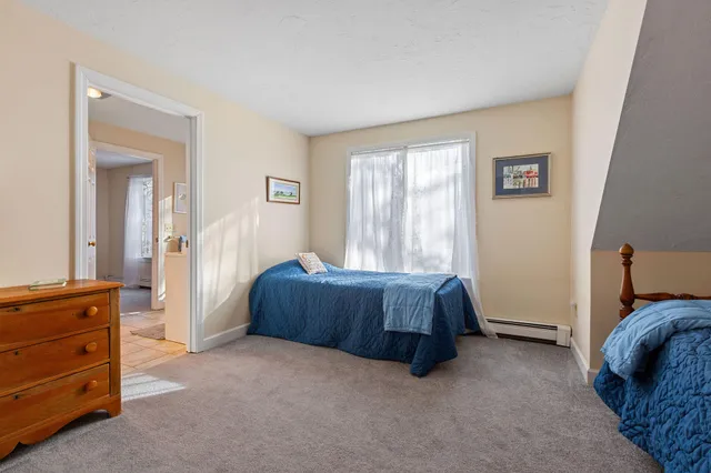 a room with furniture and a dresser