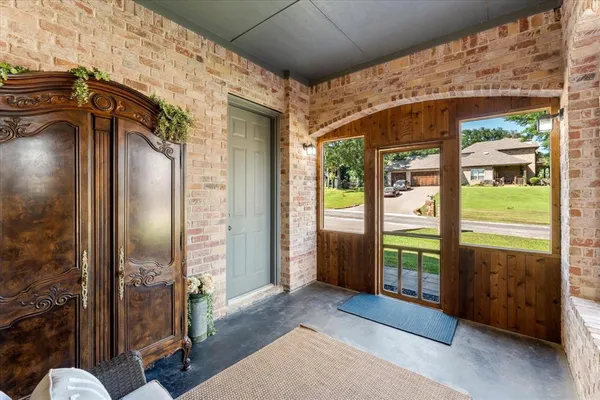 an aerial view of a house with swimming pool garden and patio