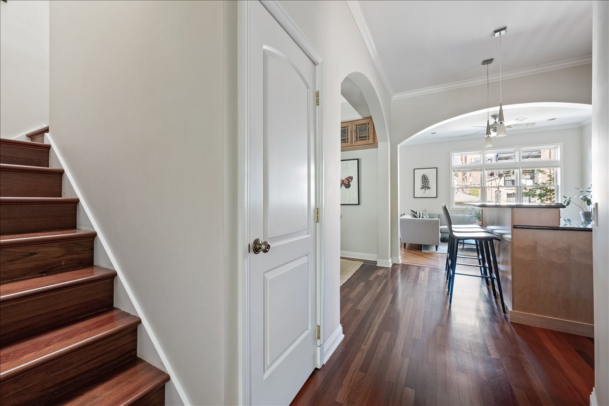 1332 West School Street Chicago, IL 60657 - Photo 11 of 45 a view of a hallway with wooden floor and dining room