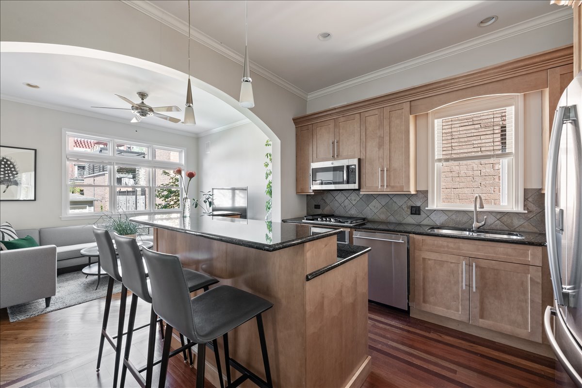 1332 West School Street Chicago, IL 60657 - Photo 13 of 45 a kitchen with granite countertop a sink and cabinets