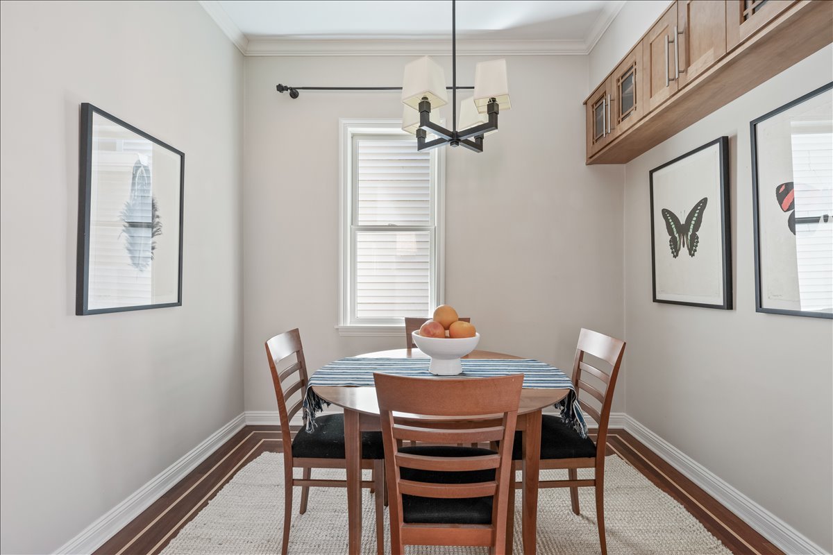 1332 West School Street Chicago, IL 60657 - Photo 15 of 45 a view of a dining room with furniture window and wooden floor