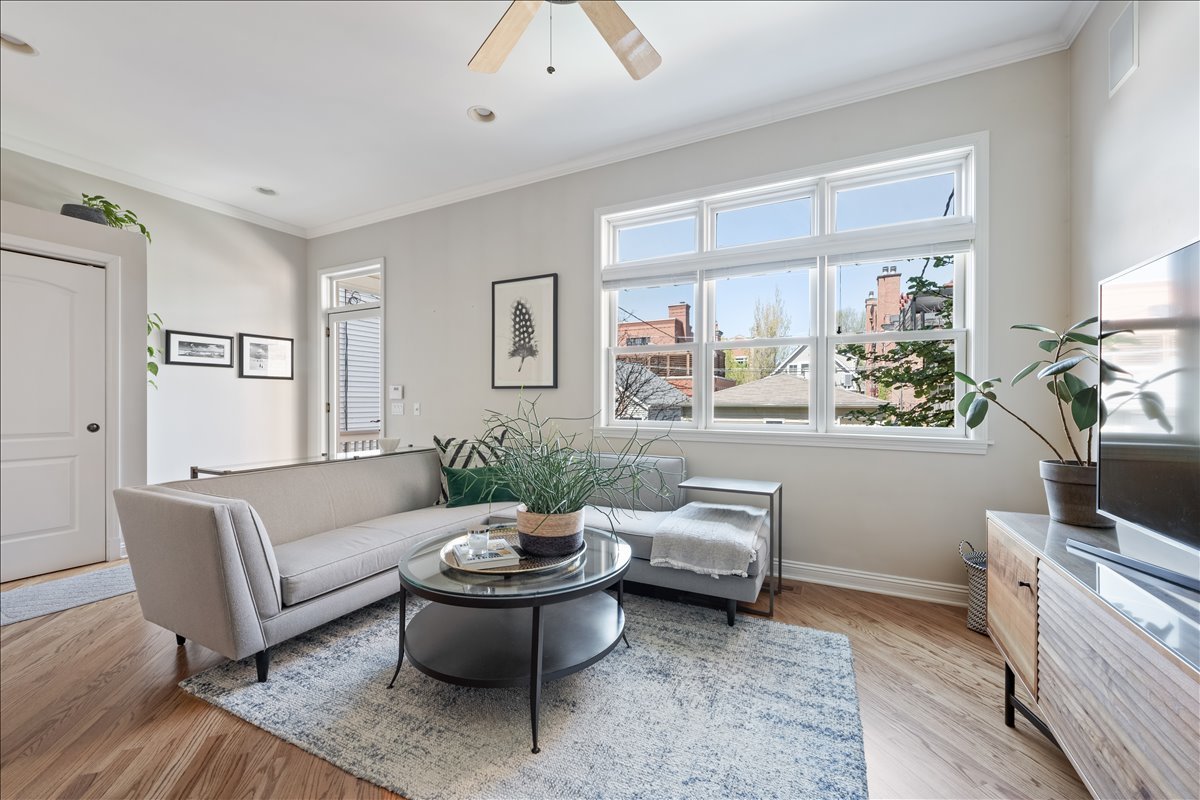 1332 West School Street Chicago, IL 60657 - Photo 19 of 45 a living room with furniture and a large window