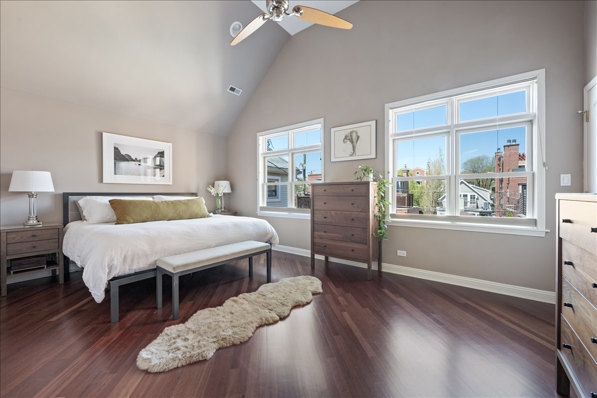 1332 West School Street Chicago, IL 60657 - Photo 22 of 45 a spacious bedroom with a bed dresser and a window