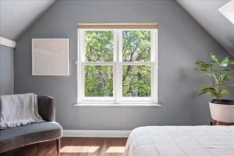 a bedroom with a bed and window