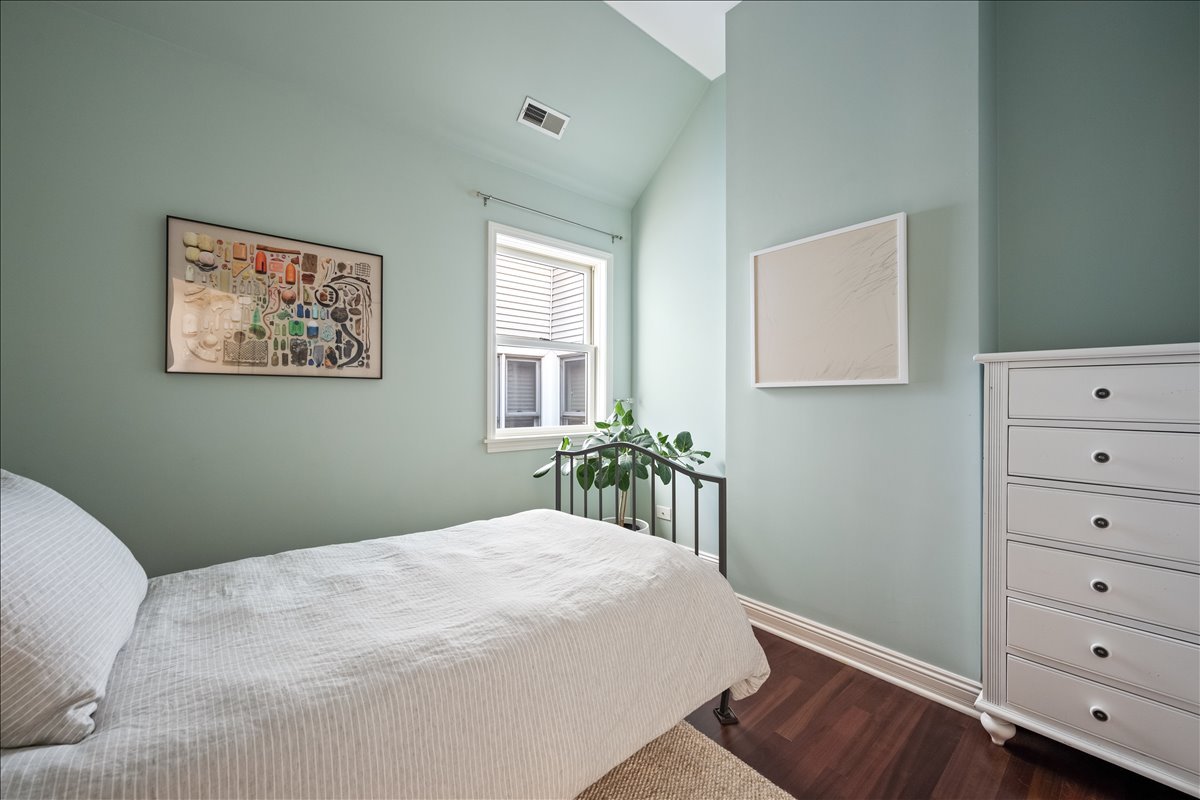 1332 West School Street Chicago, IL 60657 - Photo 28 of 45 a bedroom with a bed and a window