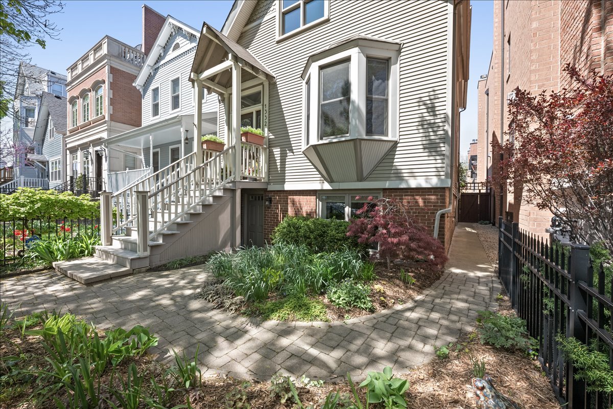 1332 West School Street Chicago, IL 60657 - Photo 3 of 45 a view of a house with a yard
